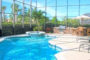 free-form inground pool with spill over spa in Naples, Fl